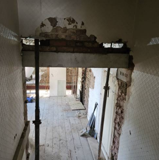 Old internal wall and chimney breast removed to open up the room