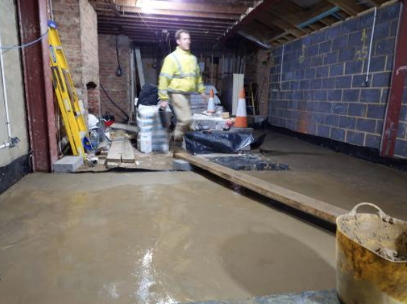 Levelling the new floor where walls were removed for open-plan space