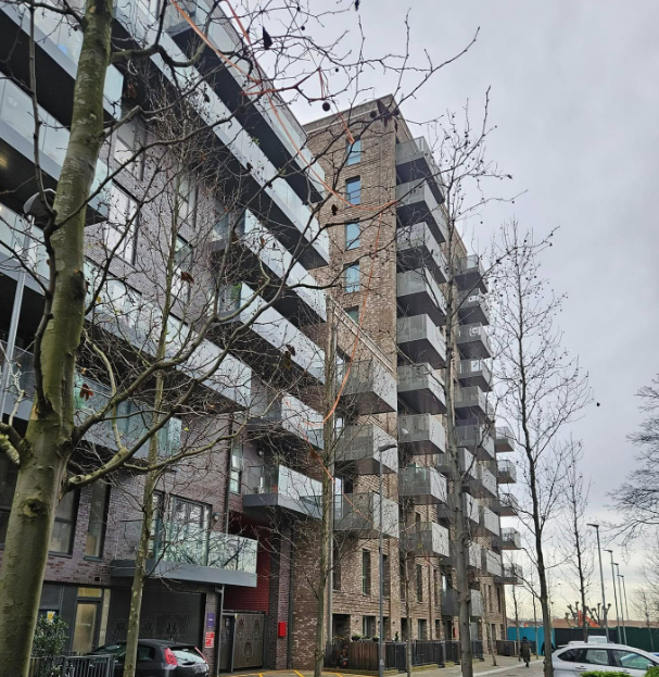 Finished brickwork facade with glass balconies