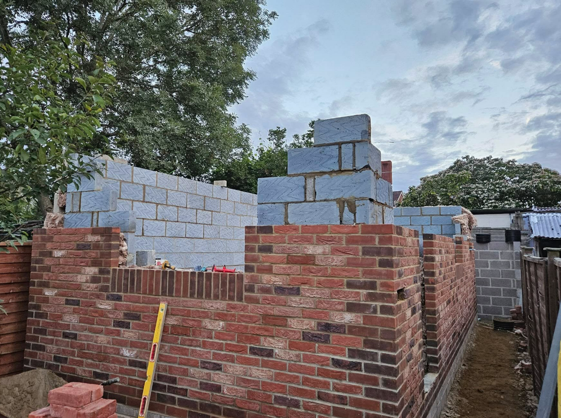 Brick and blockwork walls rising on a garage conversion