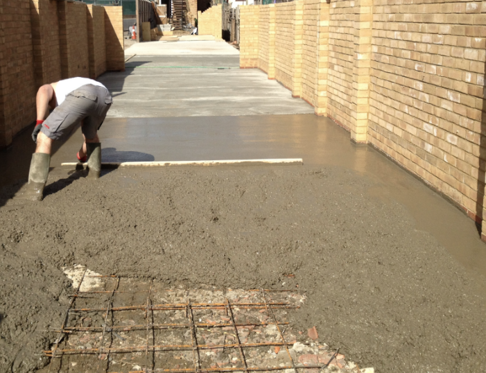 Screeding a commercial slab between brick walls