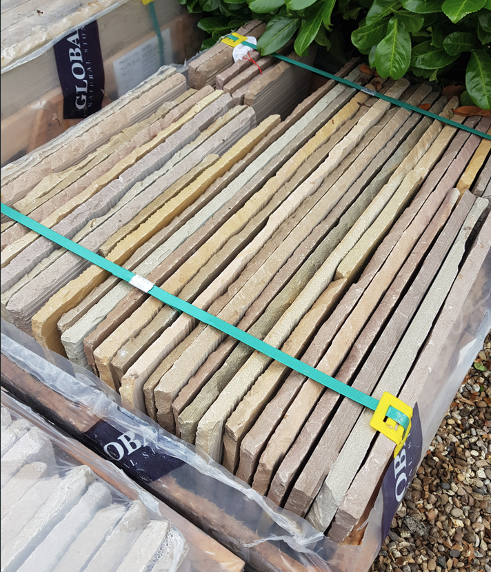 Banded sandstone paving packs ready for laying