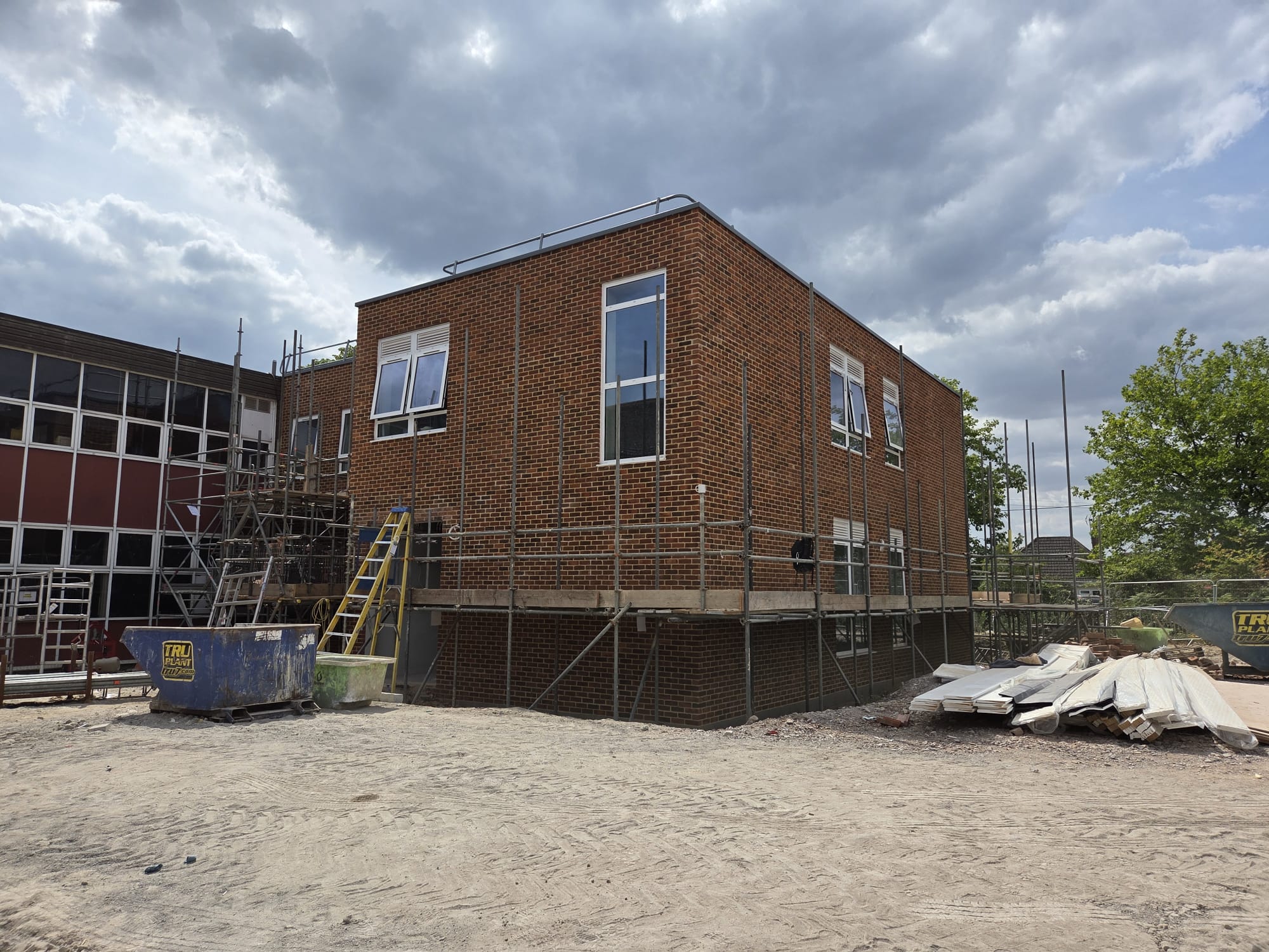 Two-storey school extension in red brick