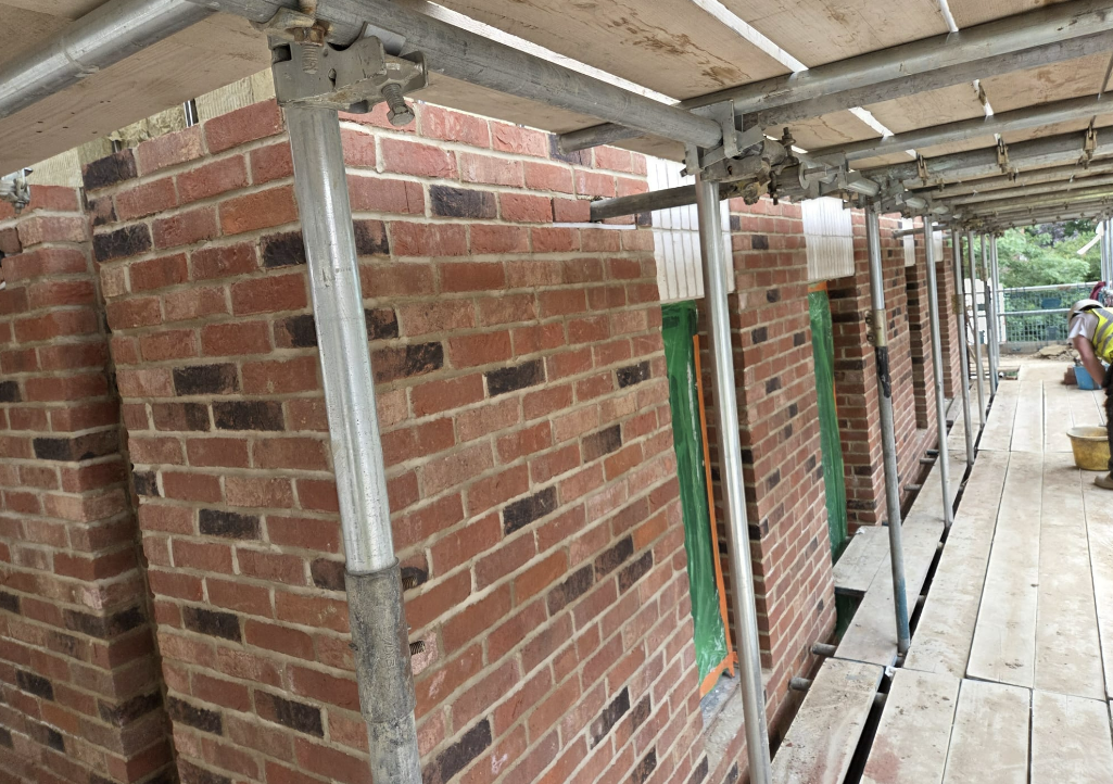 Detailed brickwork under scaffold on a school site