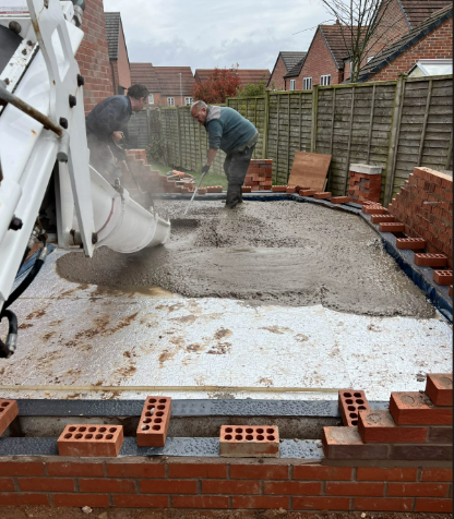 Spreading concrete on a new extension base