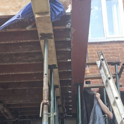 Acrow props safely supporting the structure while the wall comes out