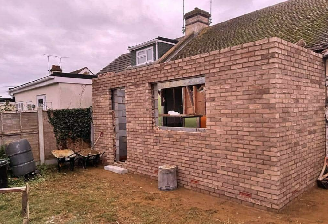 Completed extension shell in London stock brick awaiting windows