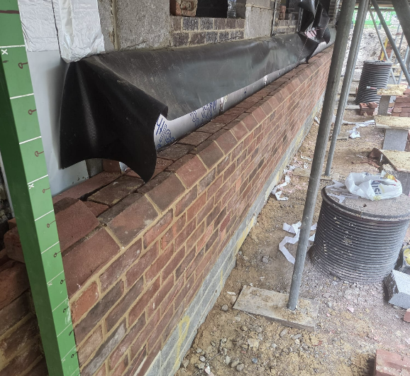 Damp-proof membrane and cavity tray detail