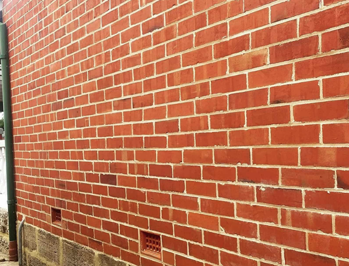 Fully re-pointed Victorian red-brick elevation